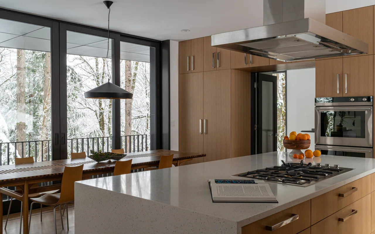 Kitchen with painted cabinetry, stone counters and a wood ceiling