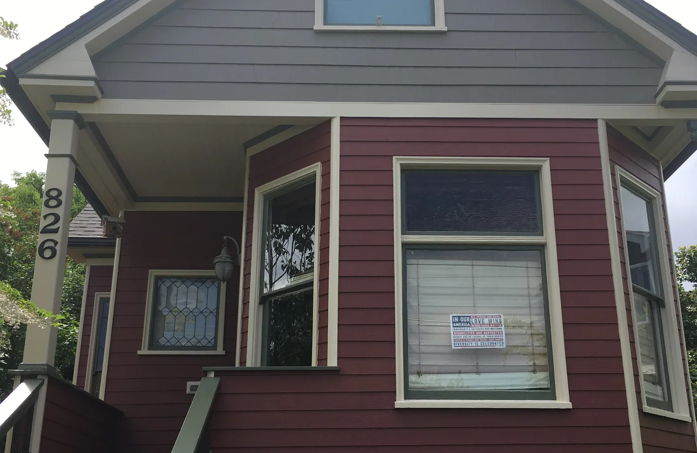 A Portland house part way through an exterior repaint
