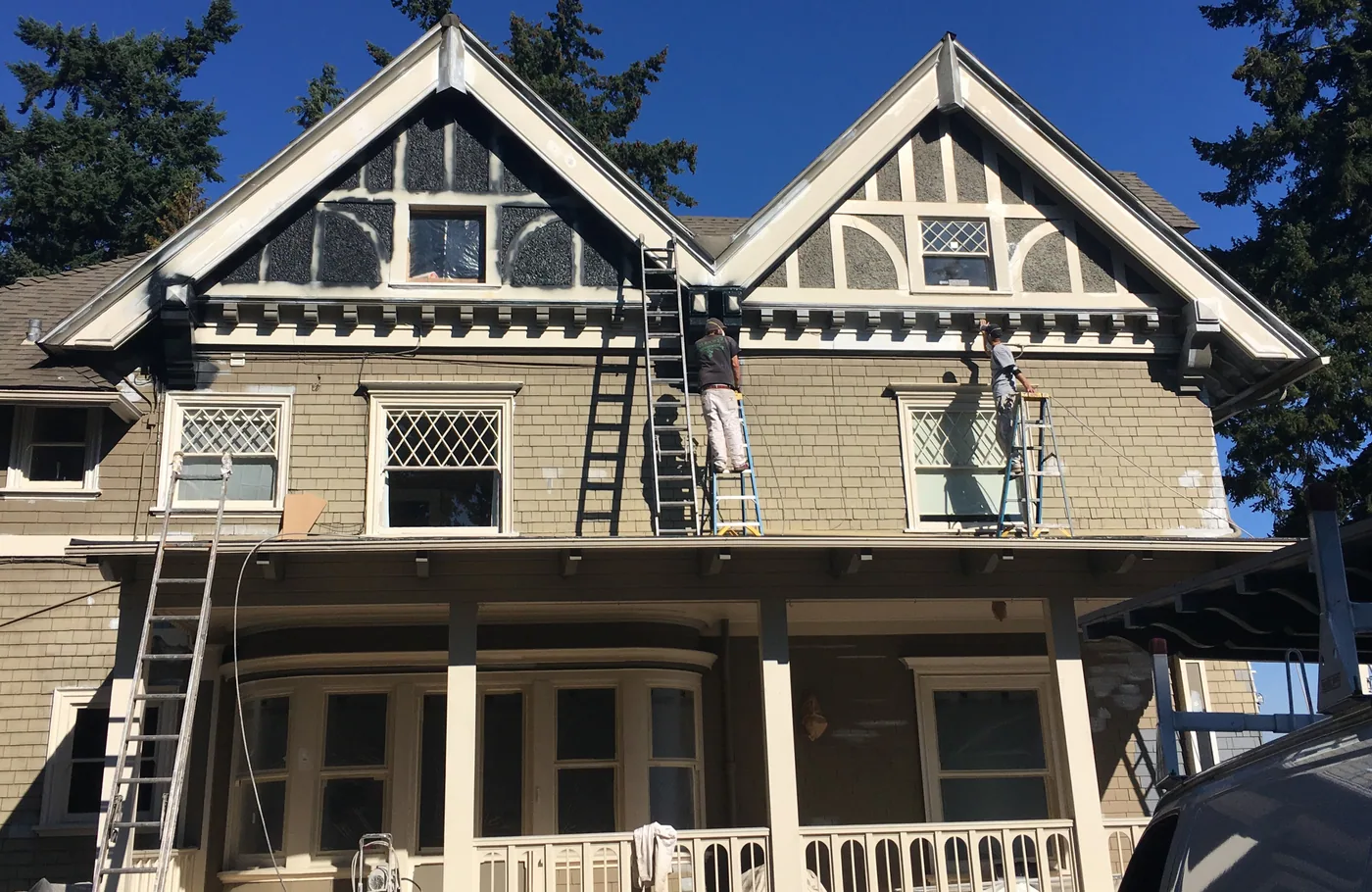 Dark shingle siding and freshly painted trim on a Portland home