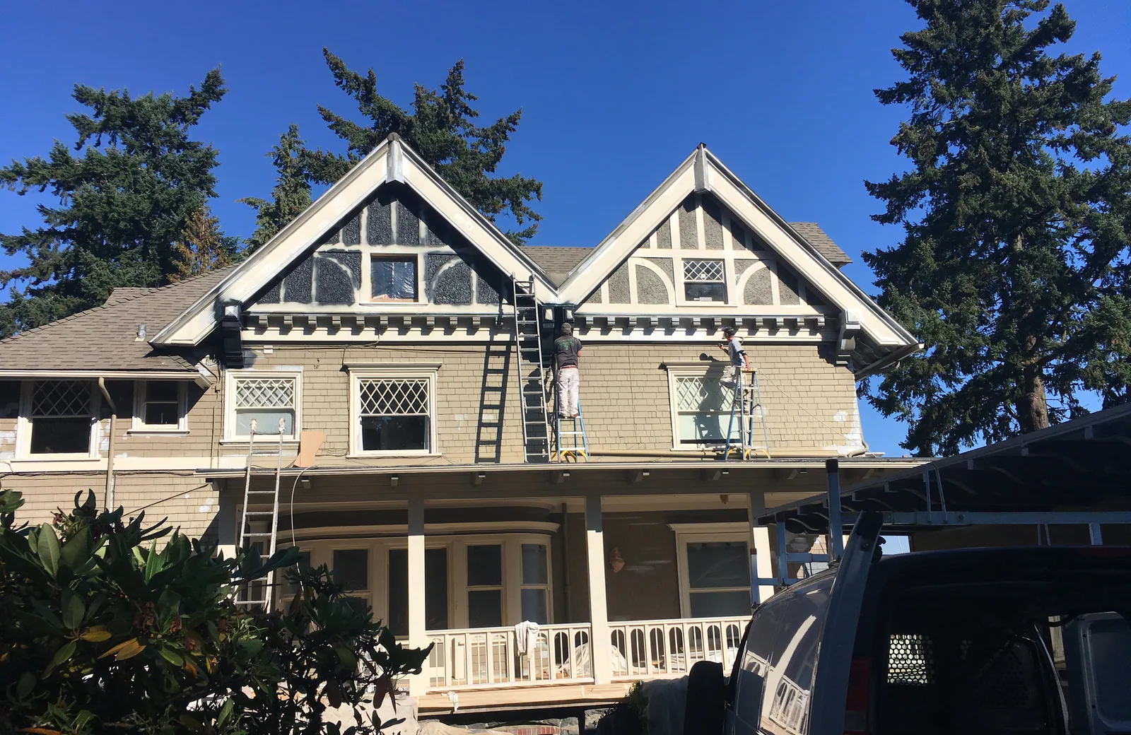 A grand Portland Victorian repainted by G & F Painting, dark body with white gable trim
