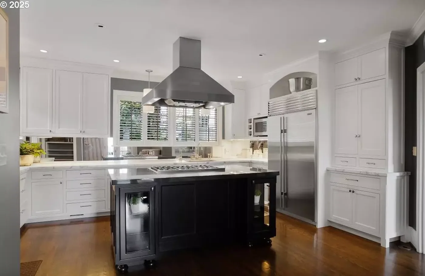 White painted kitchen with a black island