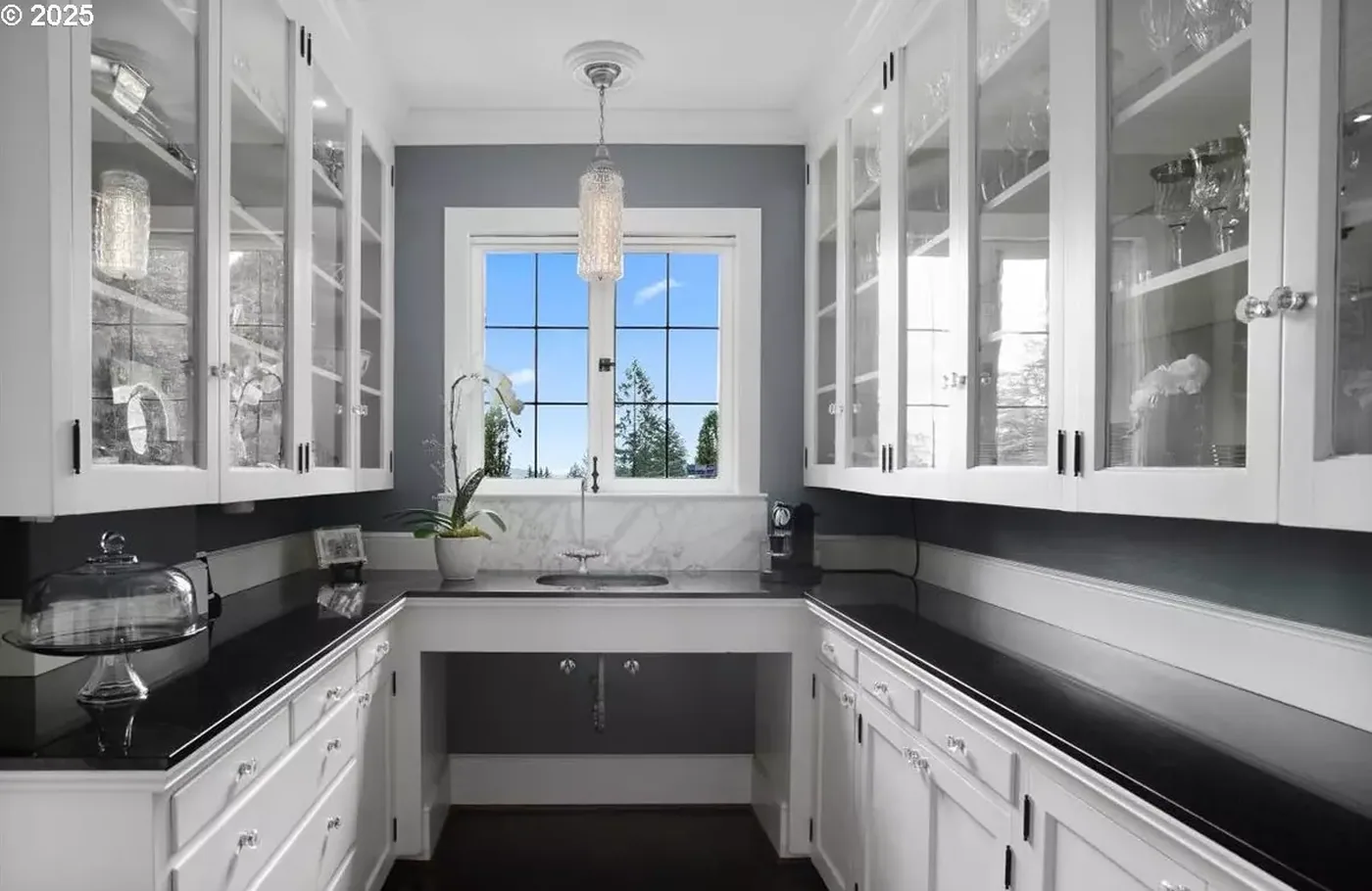 Butler pantry with glass-front cabinets