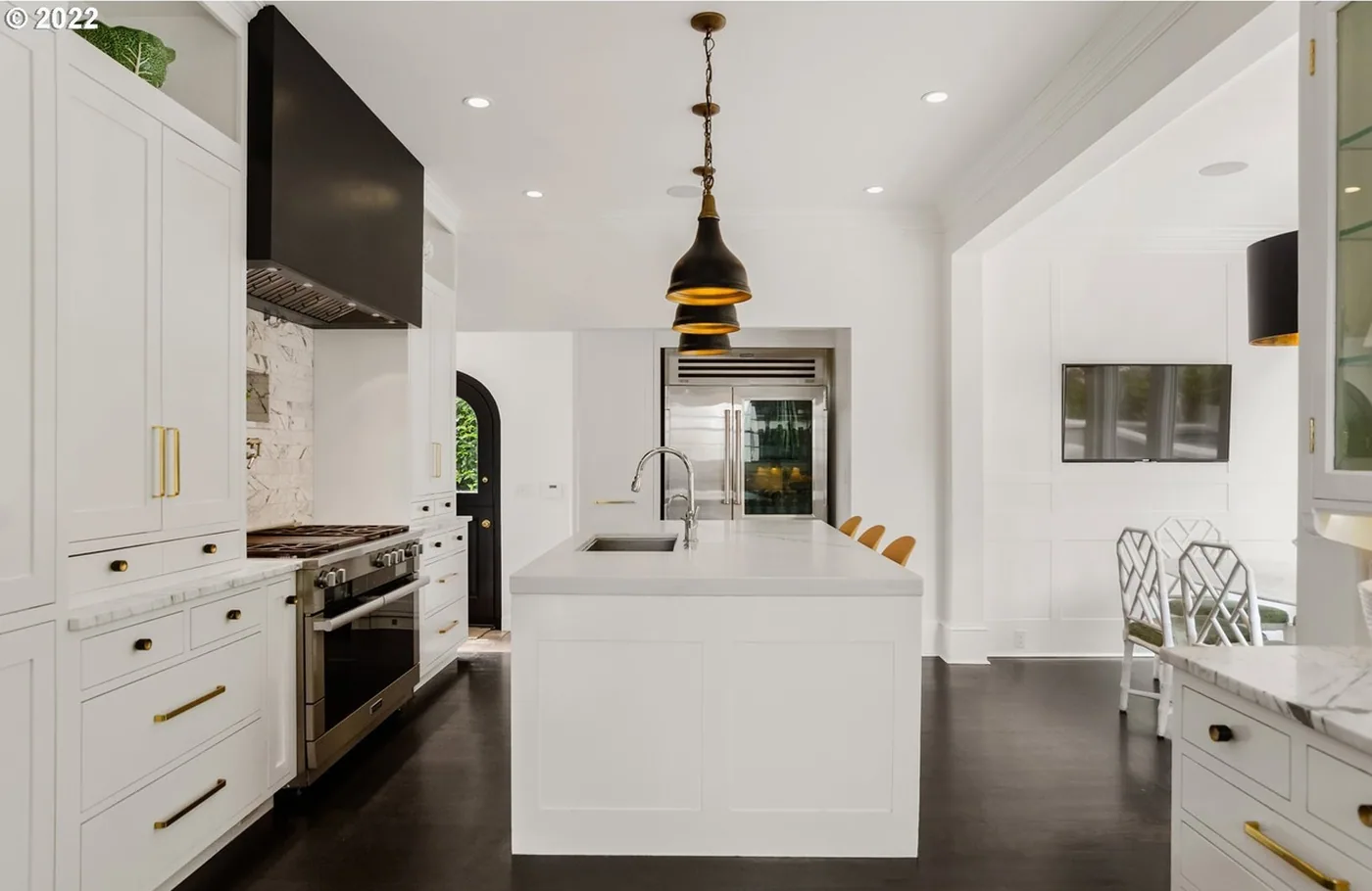 White kitchen, brass pulls and a painted island