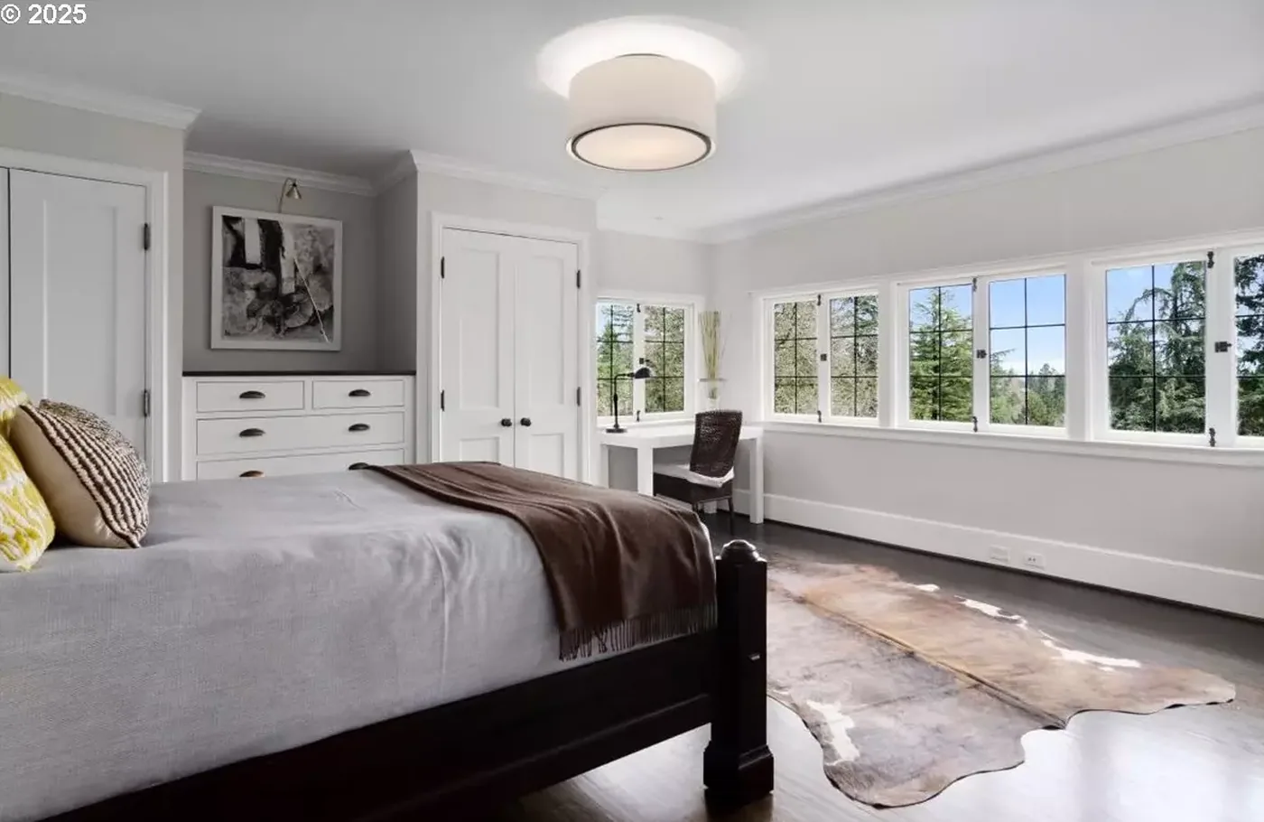 Bedroom with grey walls and white millwork