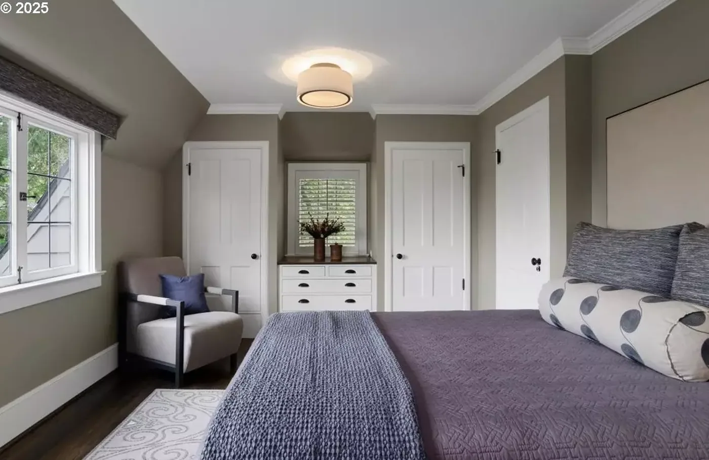 Guest bedroom with painted walls and trim