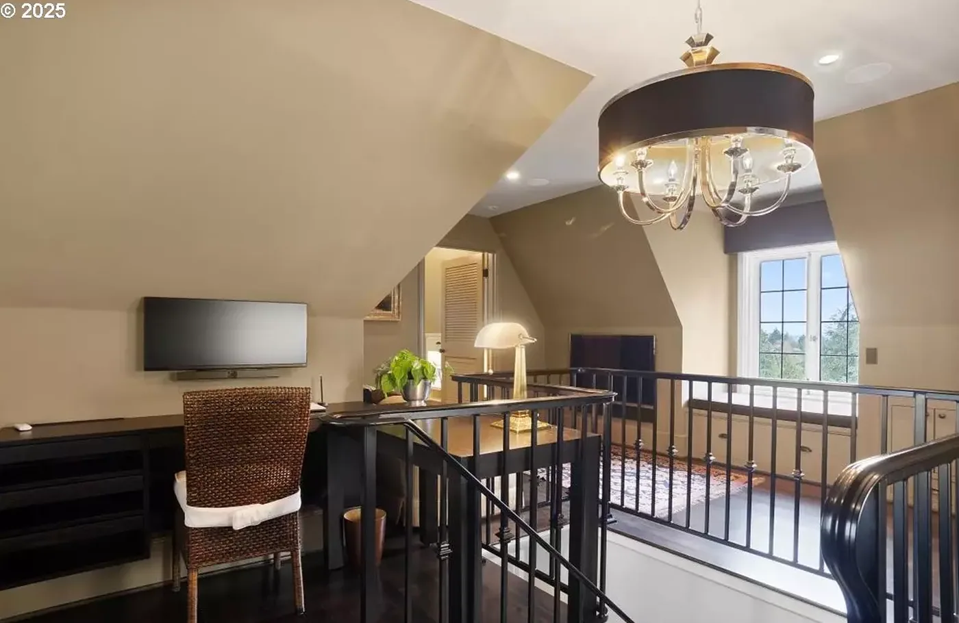 Attic office with painted walls and stair rail