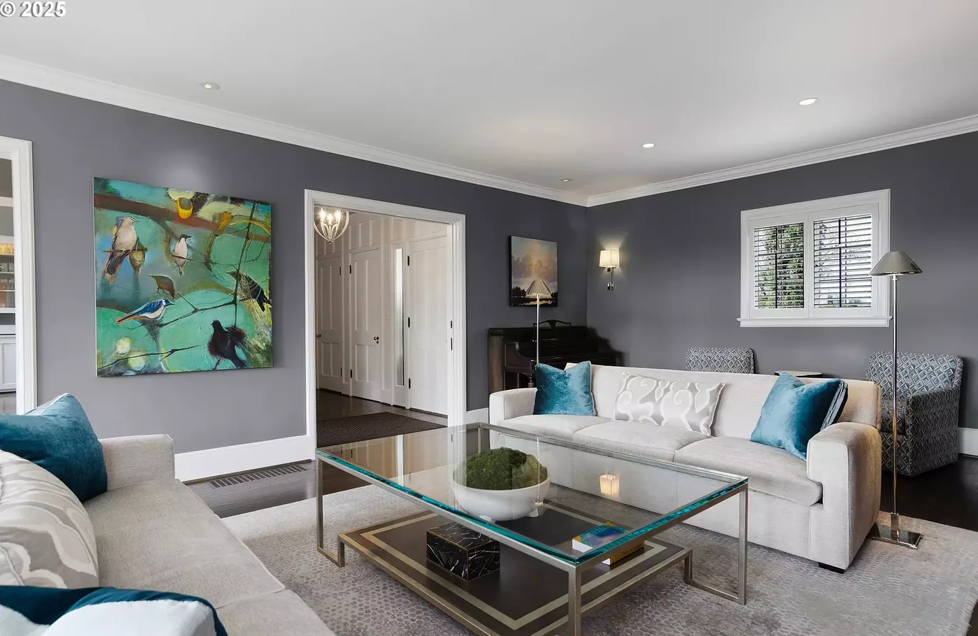 Living room with grey walls and white trim