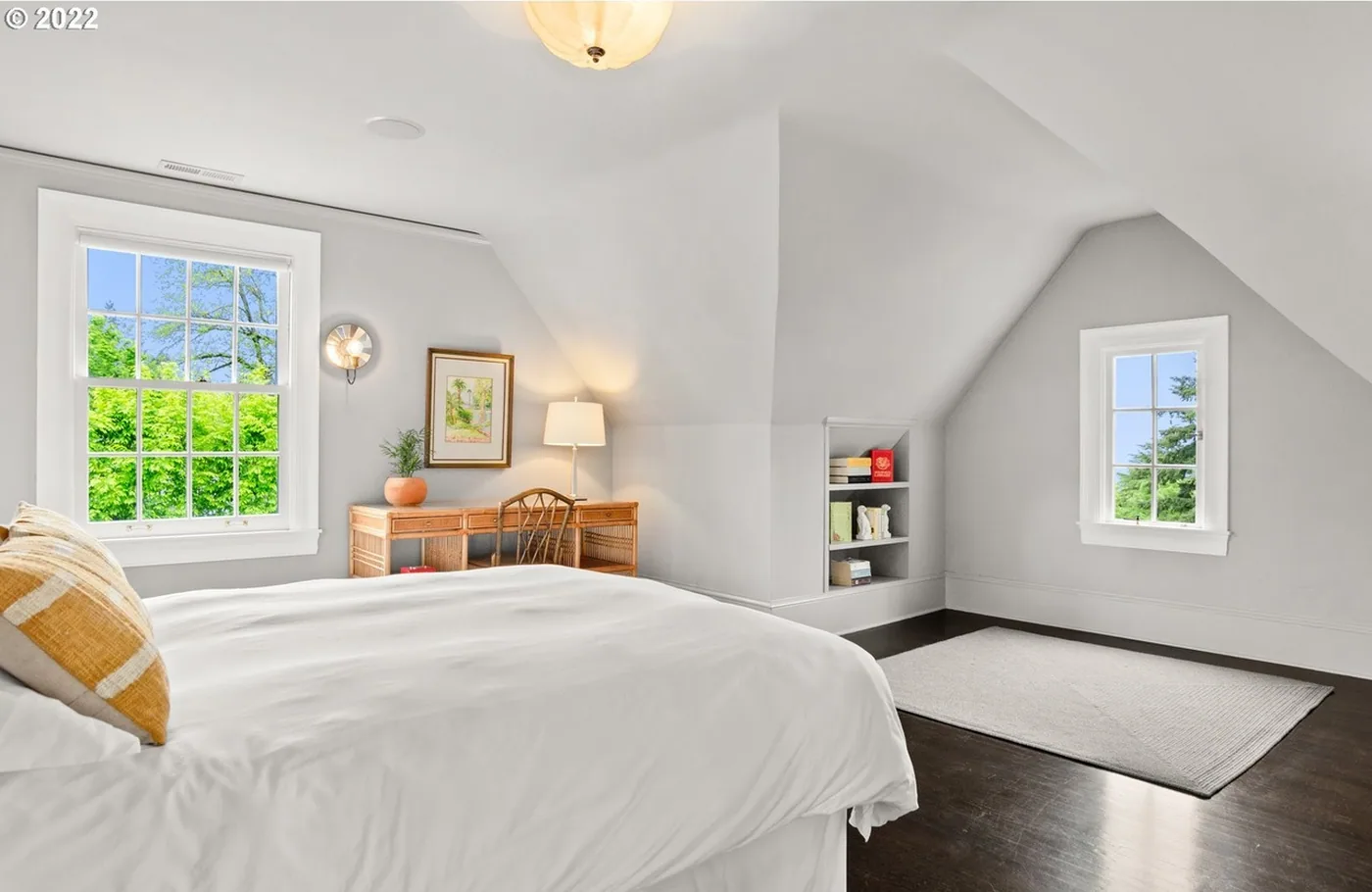 Attic bedroom with crisp white walls