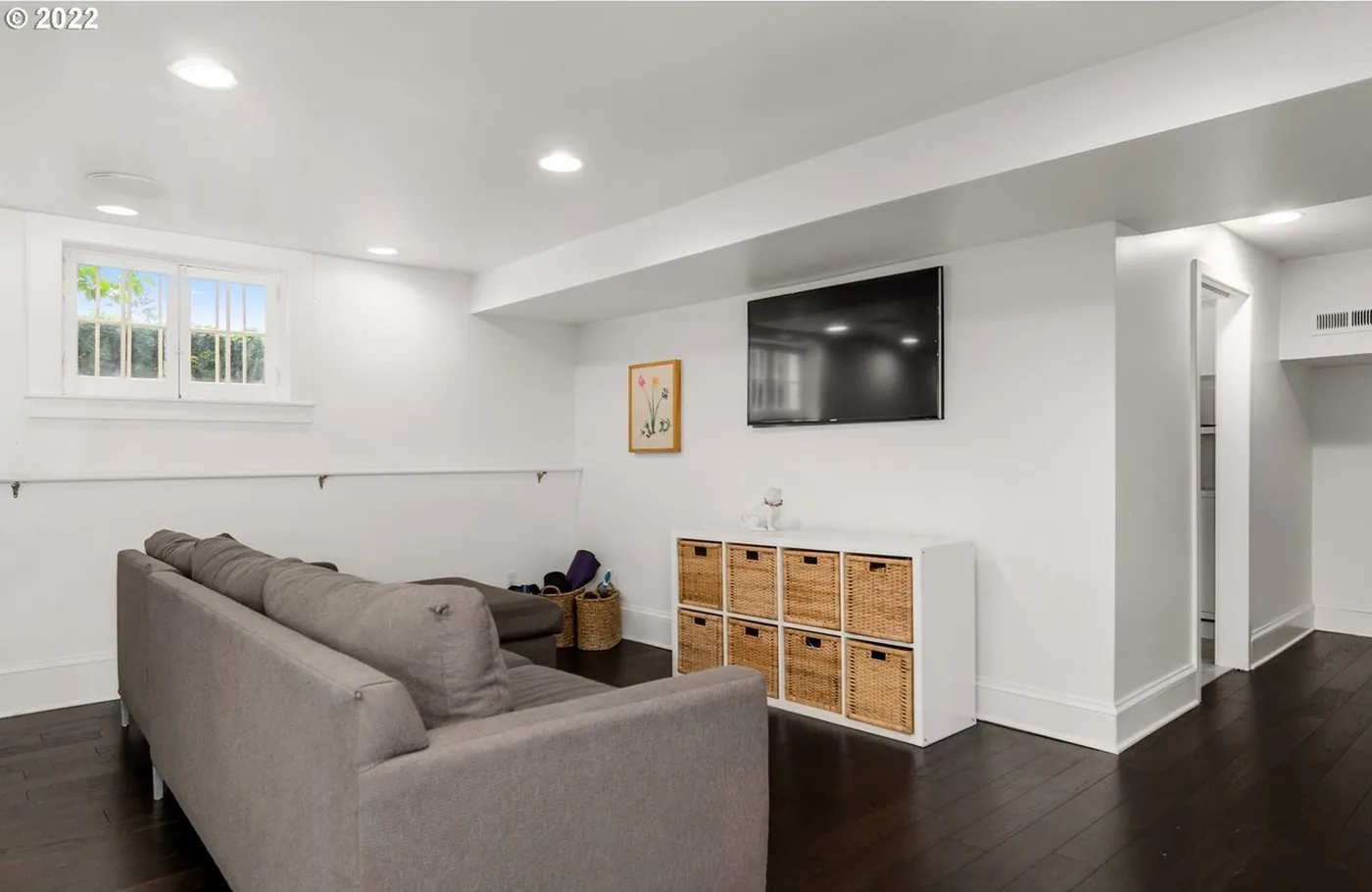 Family room with white walls and trim