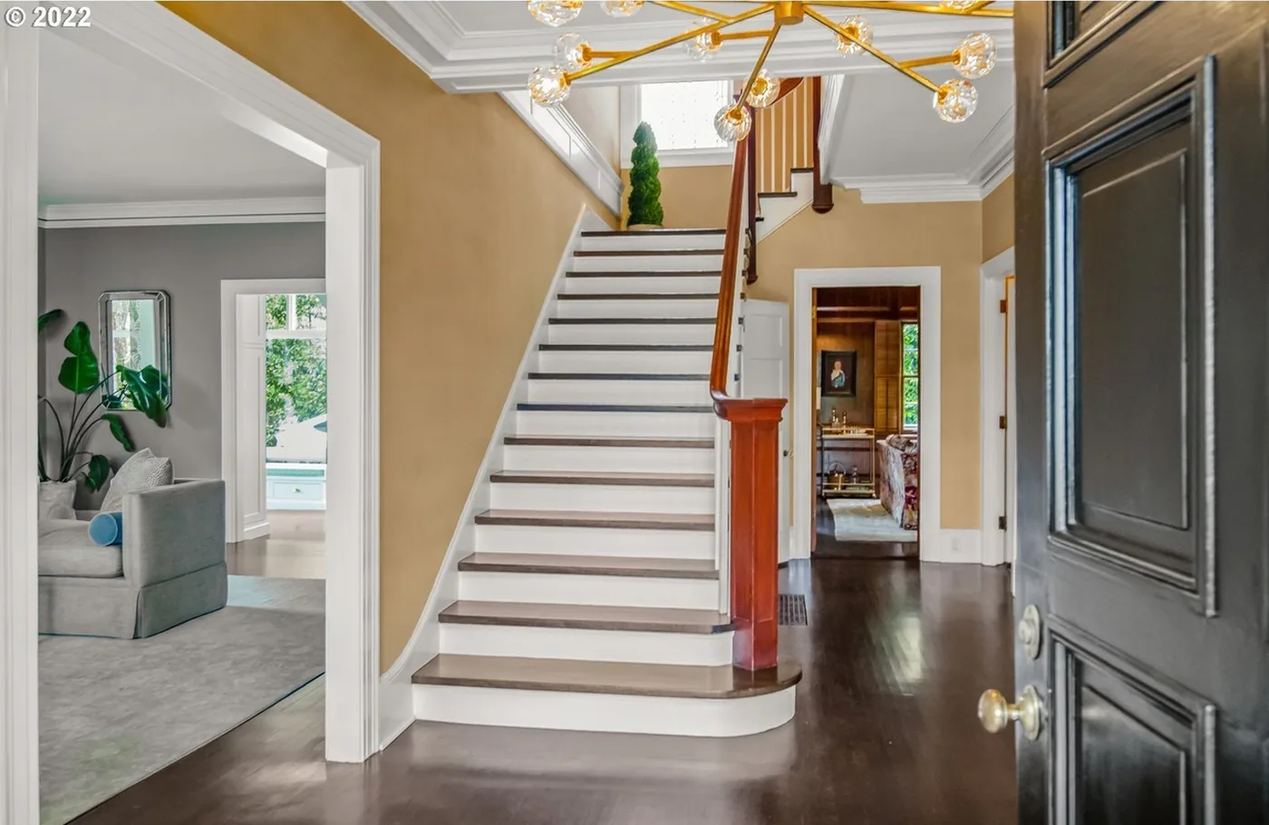Entry and stair with painted trim and doors