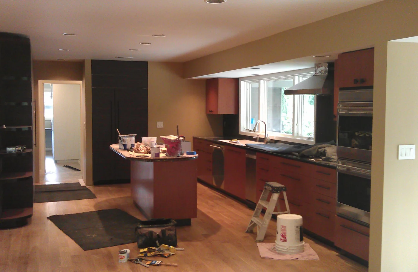 Kitchen mid-project with walls and cabinets being painted