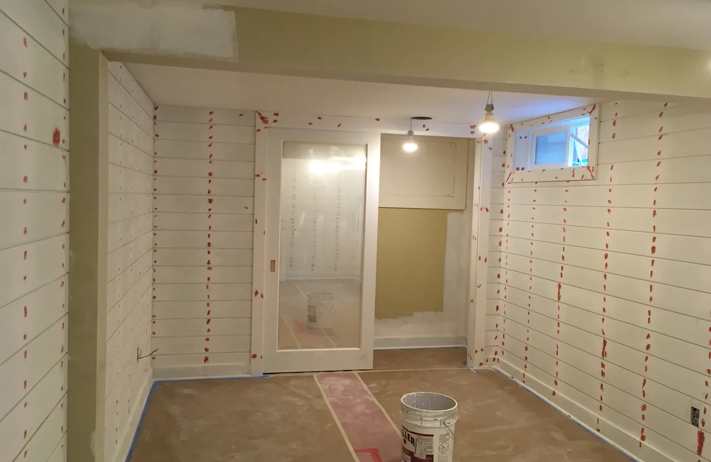 Shiplap walls filled and caulked before paint