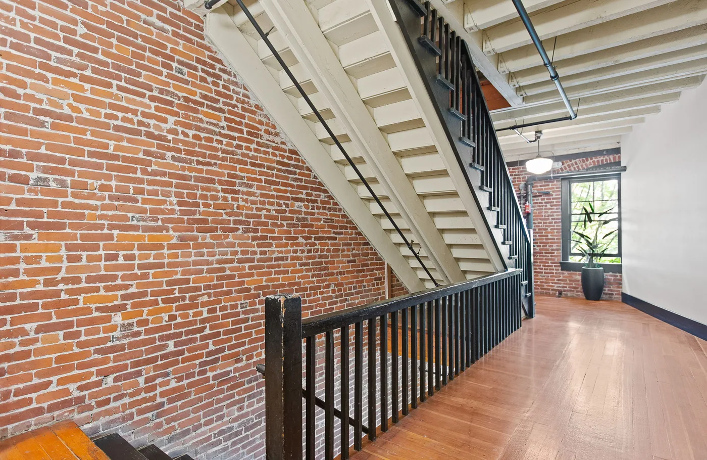 Brick stairwell and painted landing in a Portland commercial building