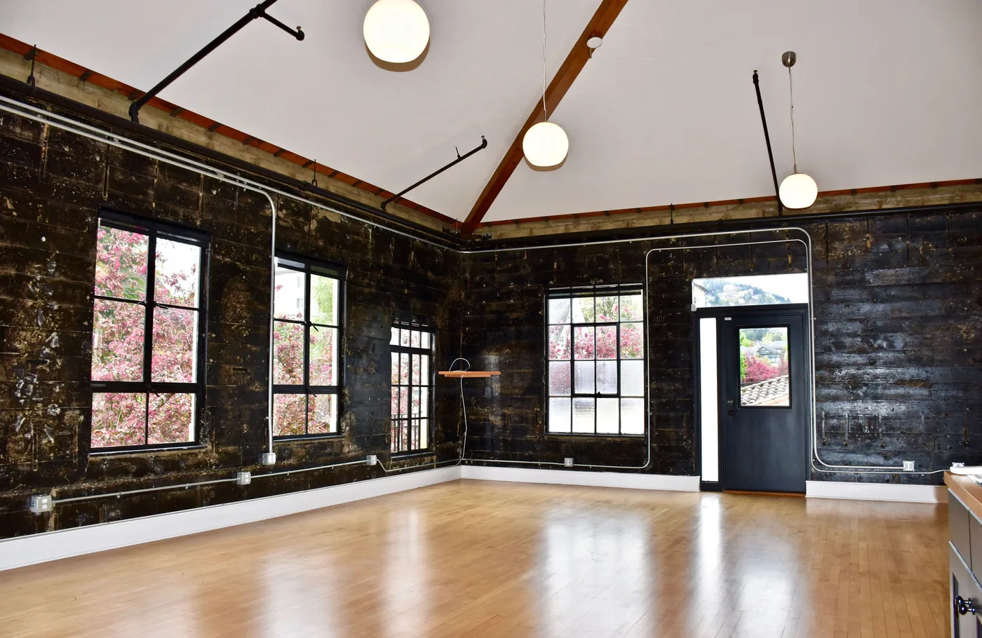 Painted commercial interior with timber trusses