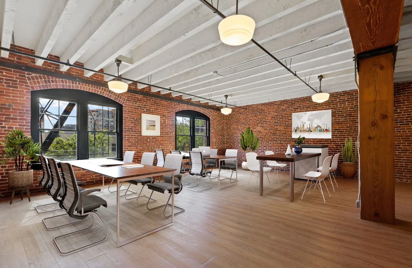Brick and timber loft office with freshly painted white walls and ceiling