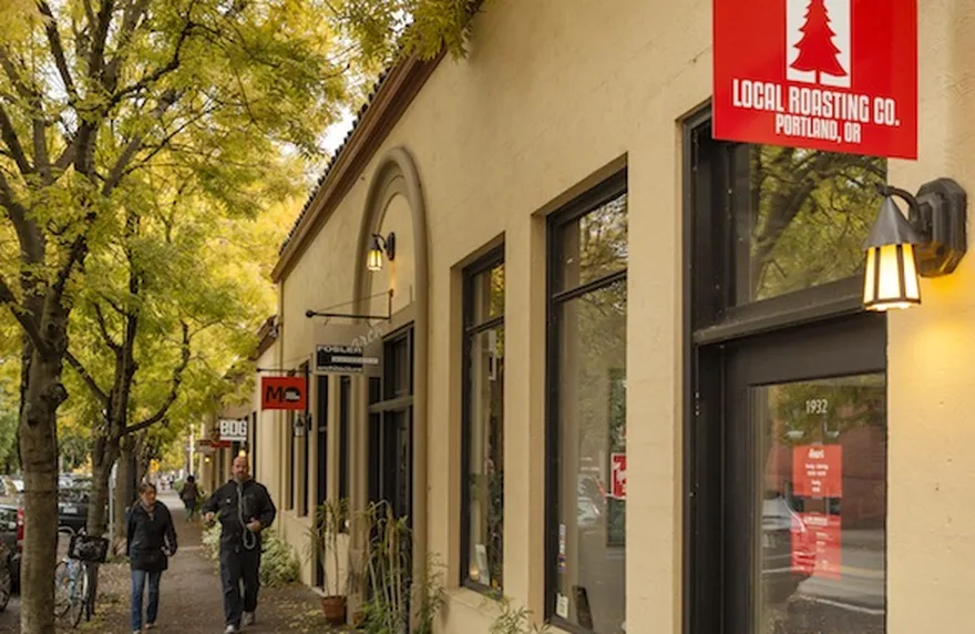Painted storefront under autumn trees at the Film Exchange in Portland