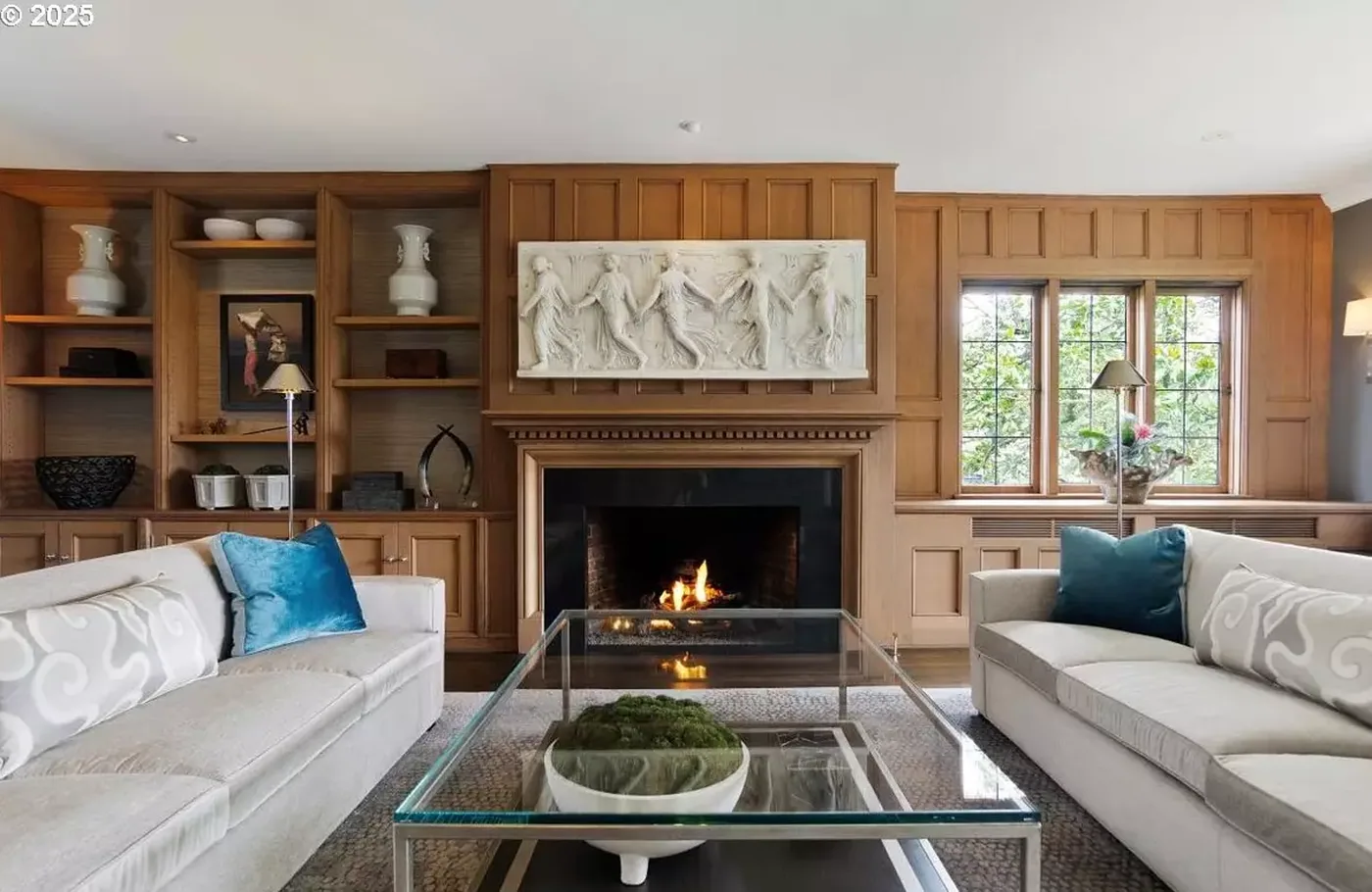 Stained wood fireplace wall with carved panel