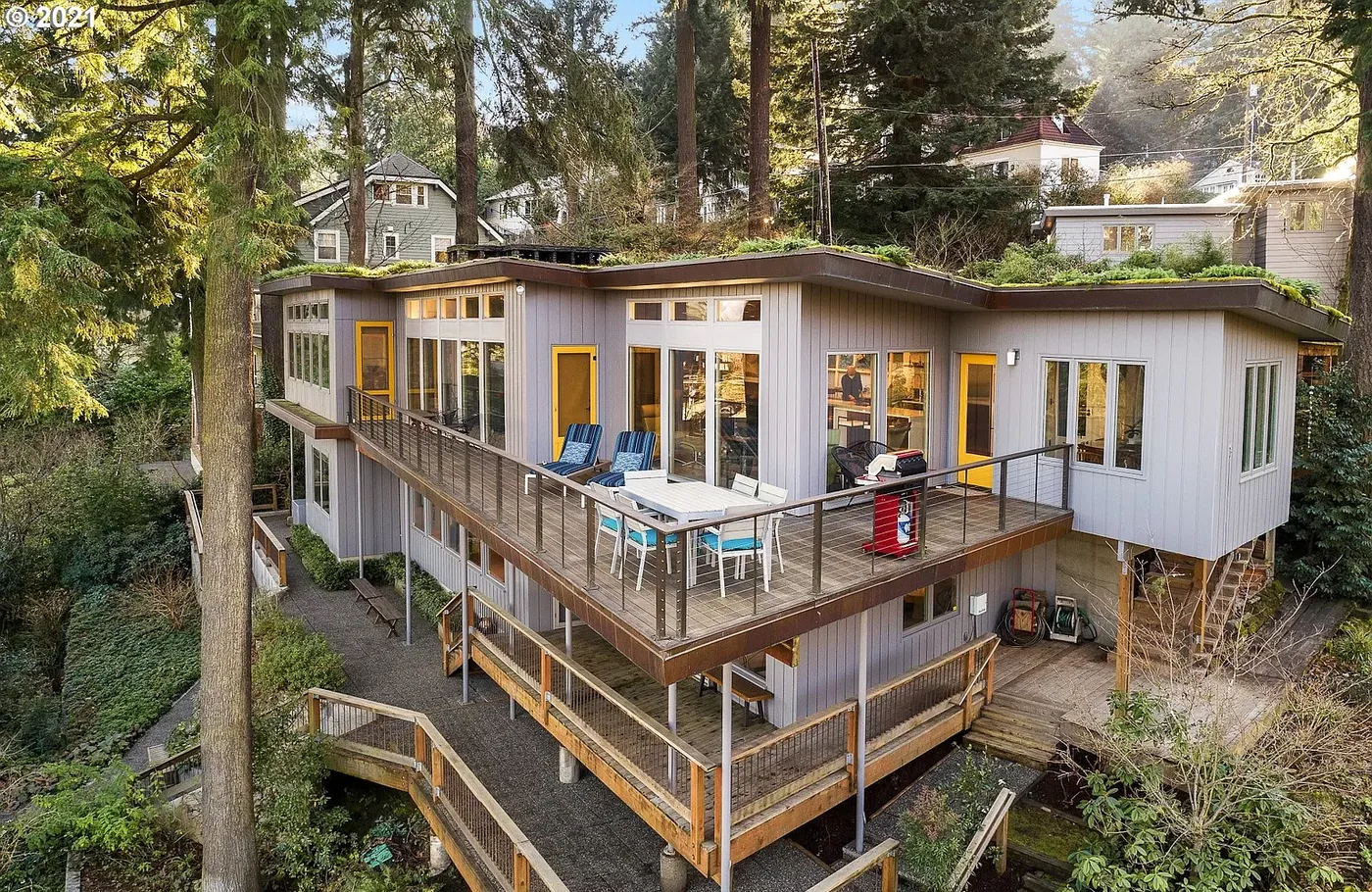 Hillside home with a long wraparound deck