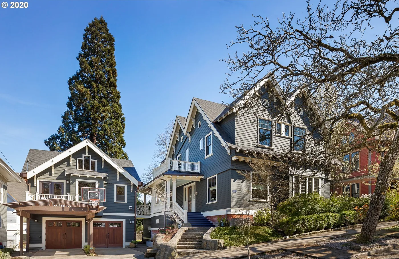 Blue craftsman homes on a Portland street