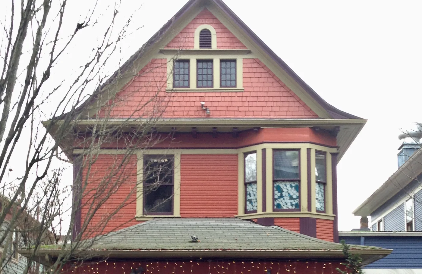 Victorian in deep red with cream trim on a Portland corner