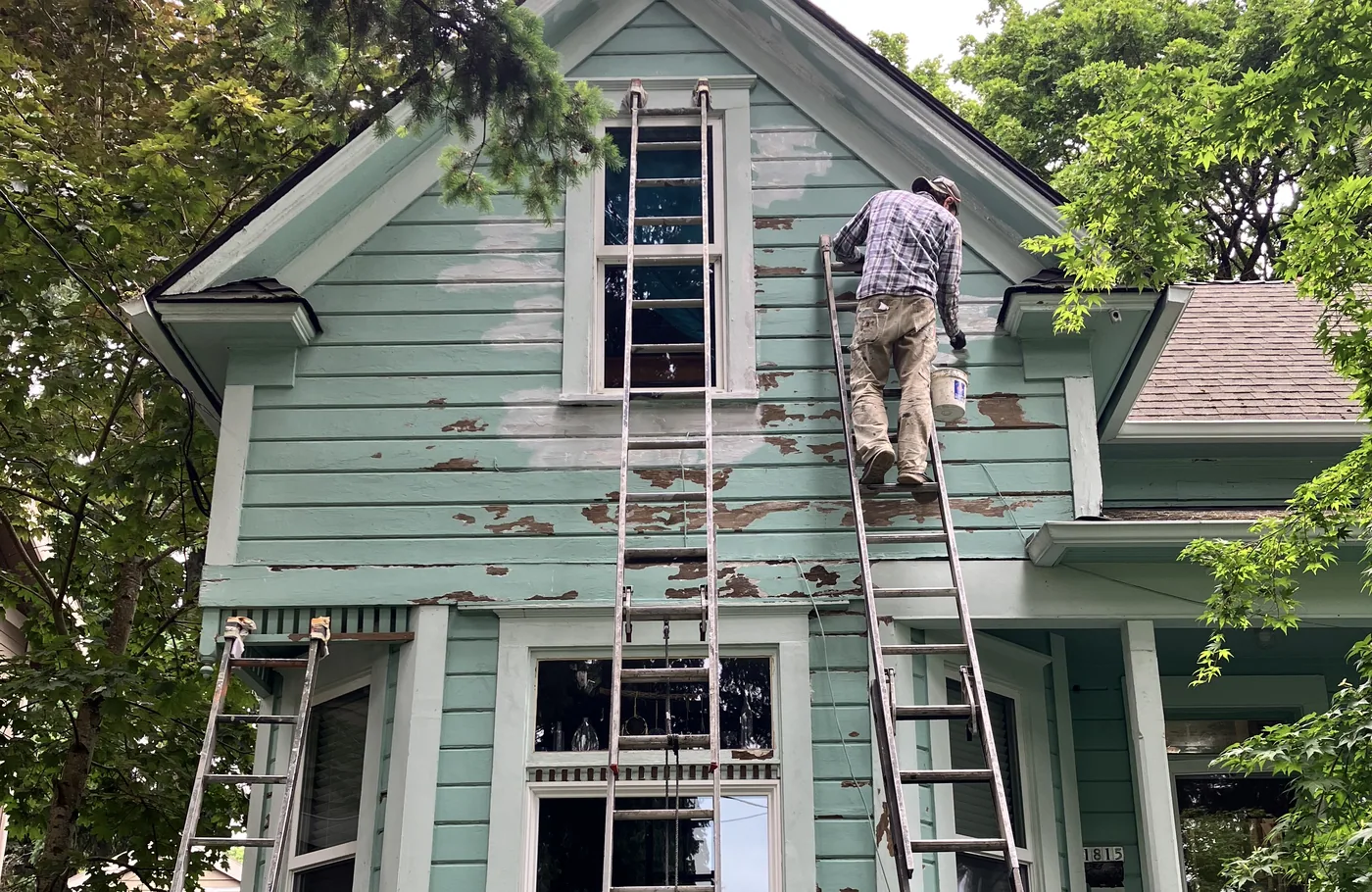 Scraping and prep on a mint-green Victorian before paint