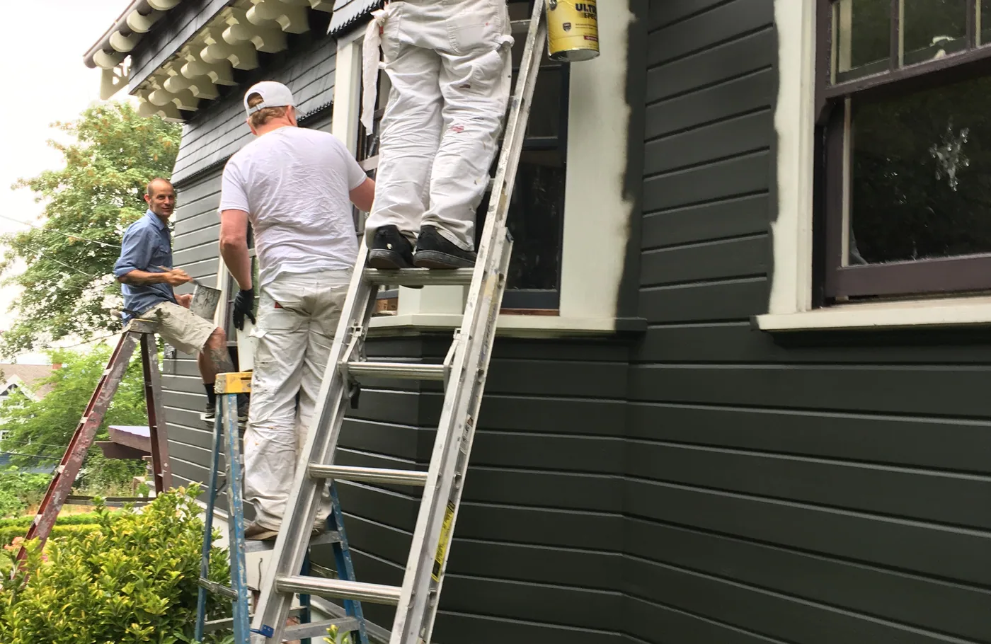 The G & F crew painting trim on a charcoal craftsman