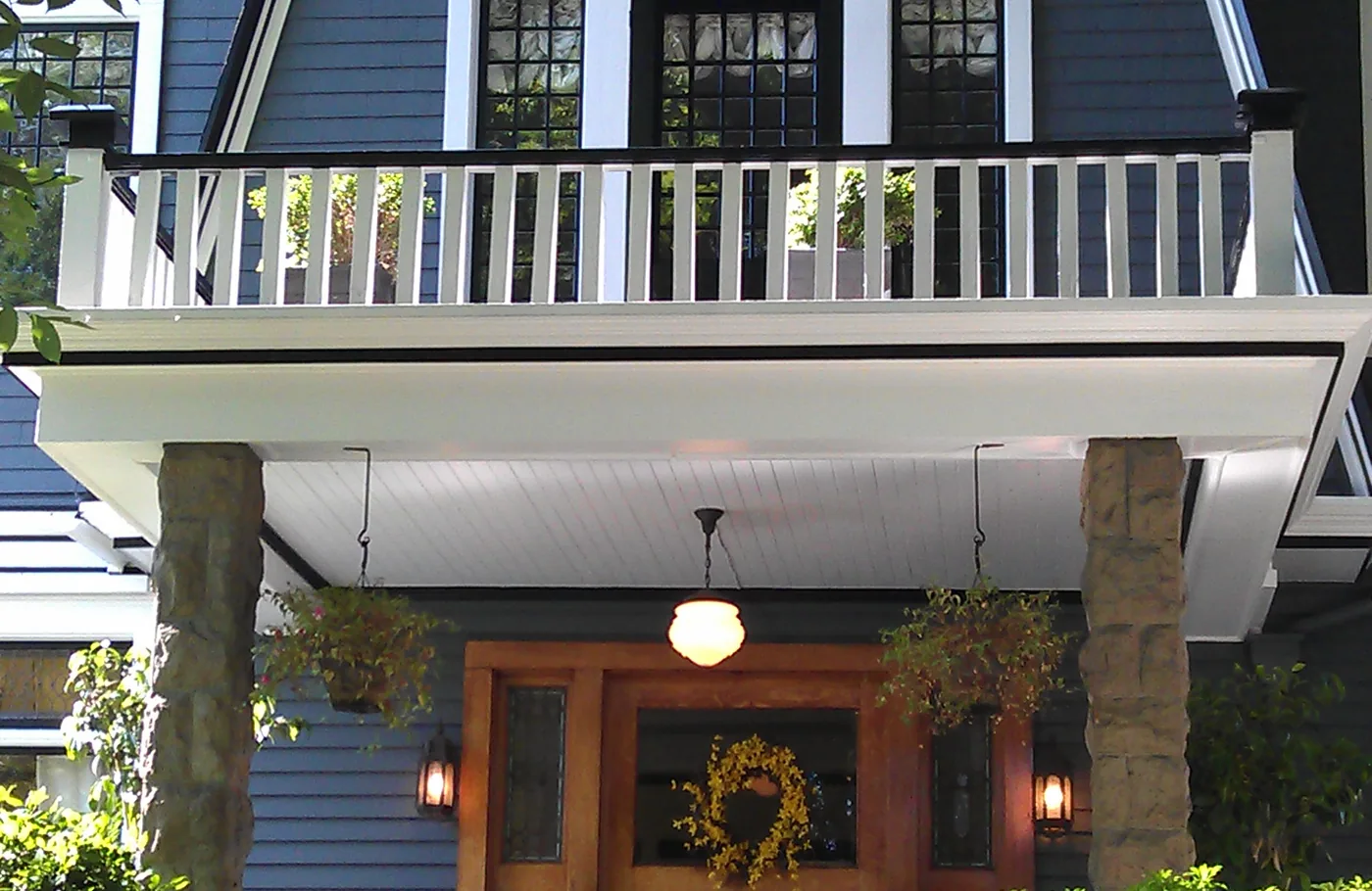 Front entry, porch and balcony of a repainted Portland home