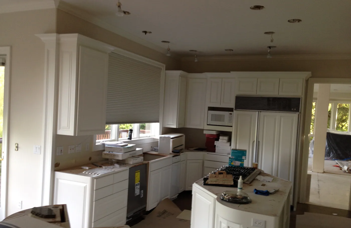 A G & F kitchen job part way through, cabinets masked off and prepped for paint