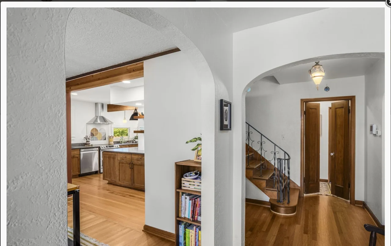 Hall and staircase with painted walls and white trim