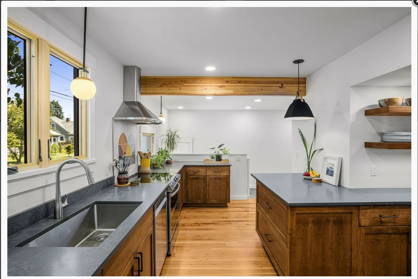 Kitchen with painted cabinets, wood counters and exposed beams