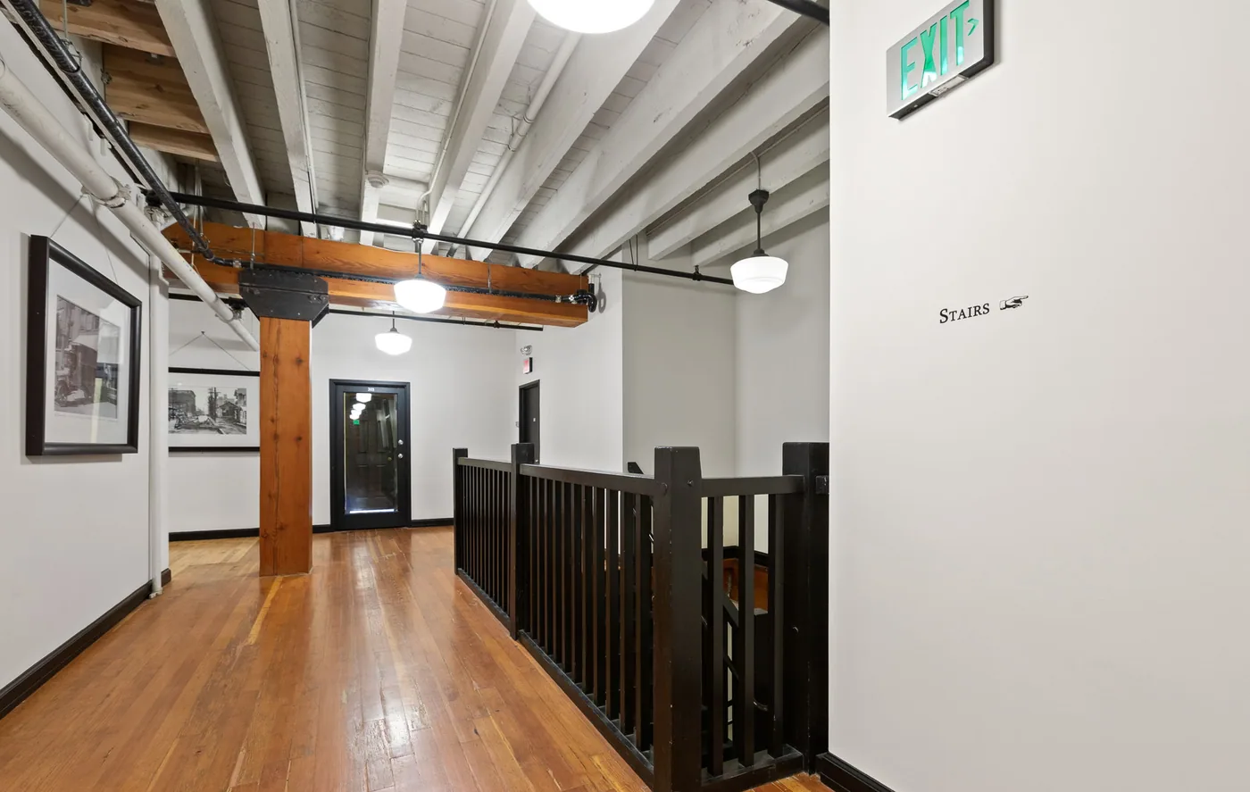 Timber posts and beams beside freshly painted walls