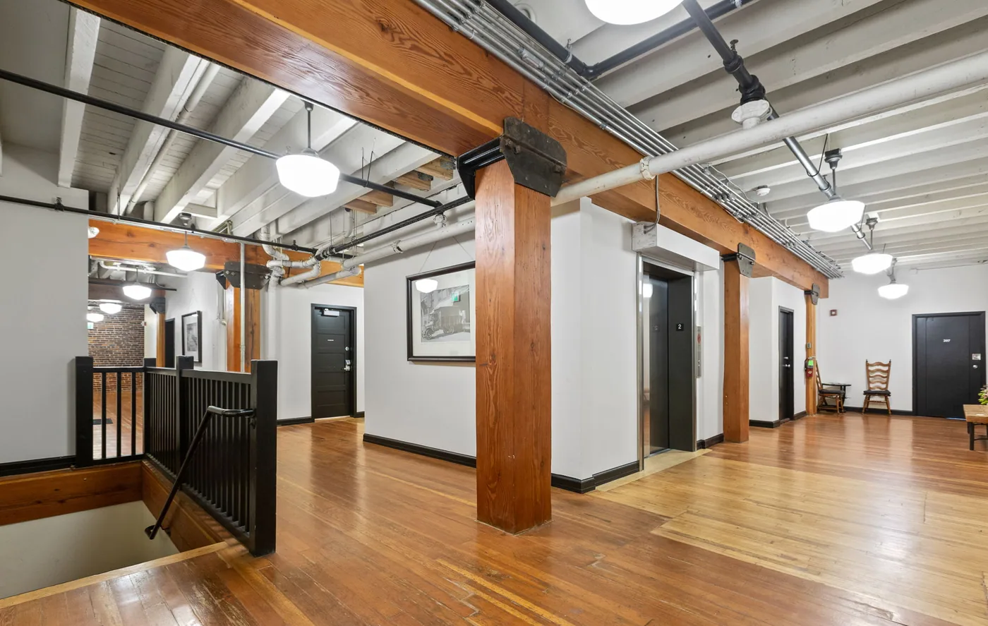 Warm timber, painted walls and a painted ceiling in a Portland building